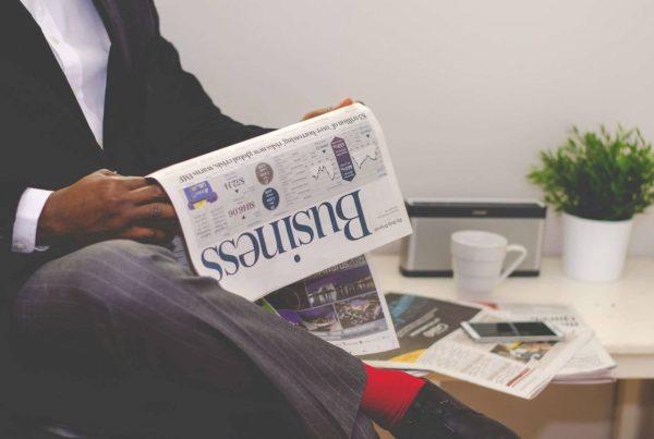 a business man readin a business newspaper - picture used in article on medicine bottlenecks germany update