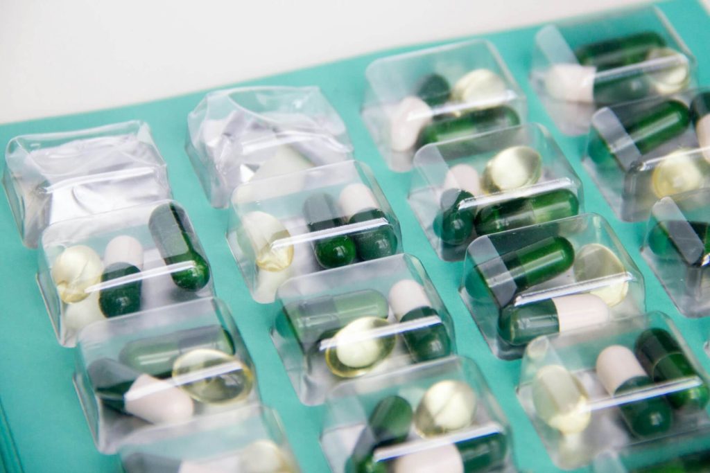 green and white medicine pills used in amoxicillin article