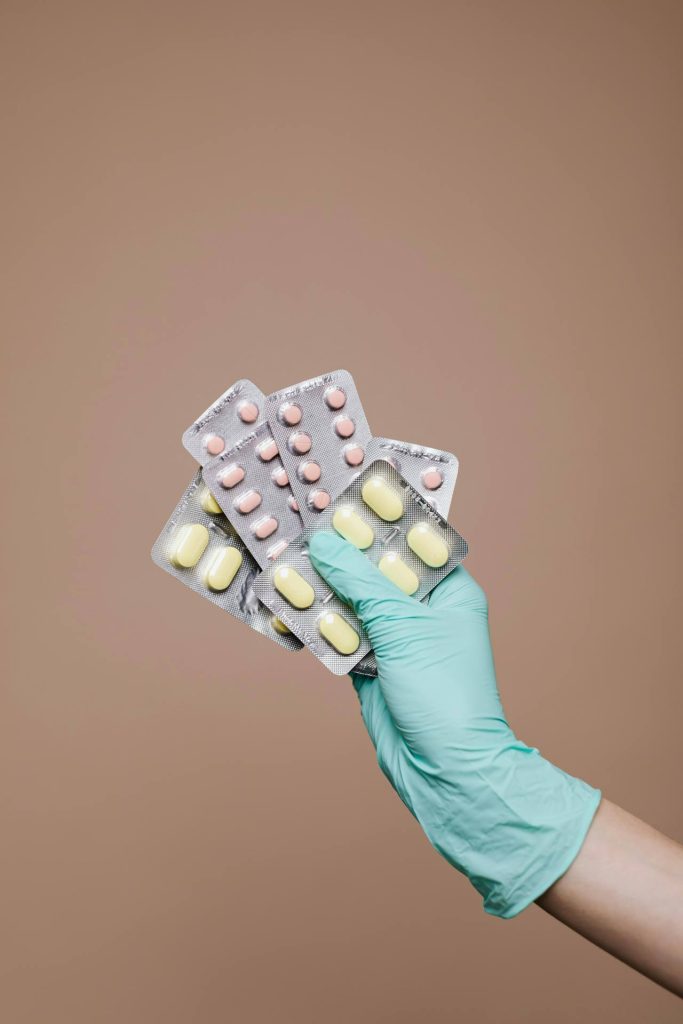 a hand holding medicine blisters - used in article on Medicine Shortages Compliance Germany