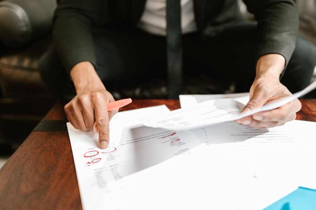 businessman signing documents - used in article on mvs pharma wholesale authorization
