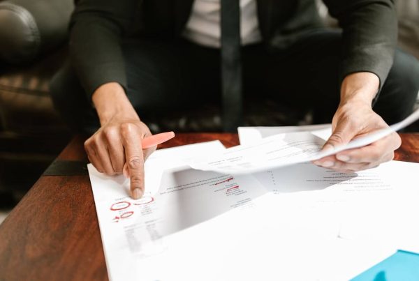 businessman signing documents - used in article on mvs pharma wholesale authorization