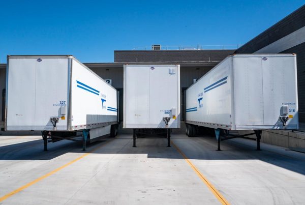 Three White Enclosed Trailers - used in article on safe pharma transportation