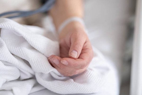 an elderly patient whose blood pressure is measured