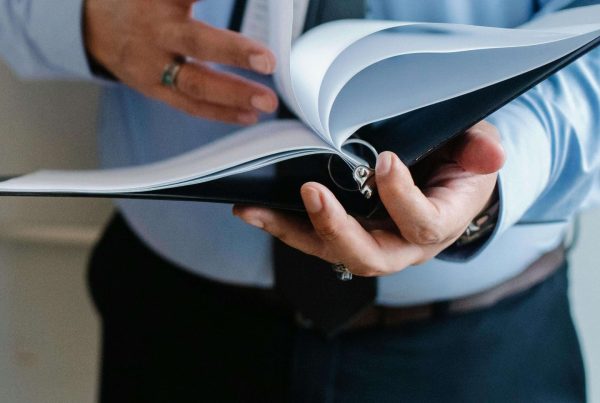 quality management person in a suit holding document folder showcasing mvs pharma GmbH quality system