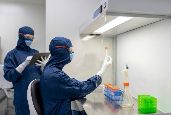 Laboratory technicians checking test tube - falsified medicines prevention at Mvs Pharma GmbH