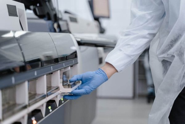 Person in Lab Coat and Latex Glove pulling a Drawer - mvs pharma GDP compliant Goods Receipt Process